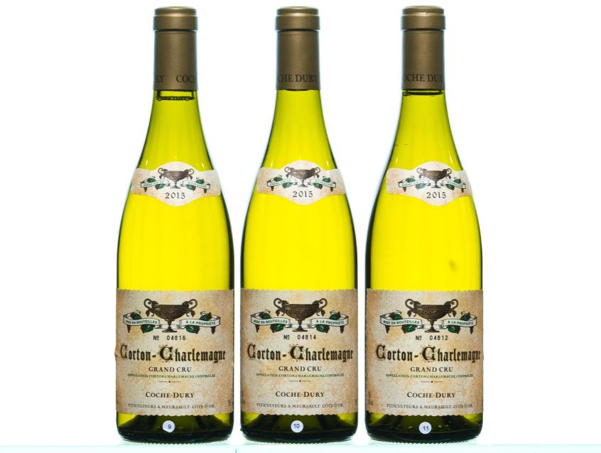 Three bottles of Coche Dury Corton Charlemagne Grand Cru 2015 wine